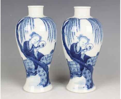 A near pair of Chinese blue and white porcelain vases, mark of Kangxi but 20th century or later, each baluster body painted w