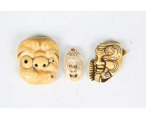 A Japanese carved ivory noh mask netsuke, Meiji period, modelled as Hyottoko with pierced eyes, nostrils and whistling mouth,