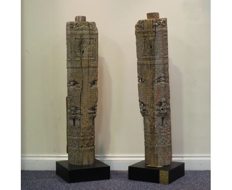 A pair of Indian Gujarat carved wood architectural columns, 16th/17th century, decorated in relief with figures, scrolls and 