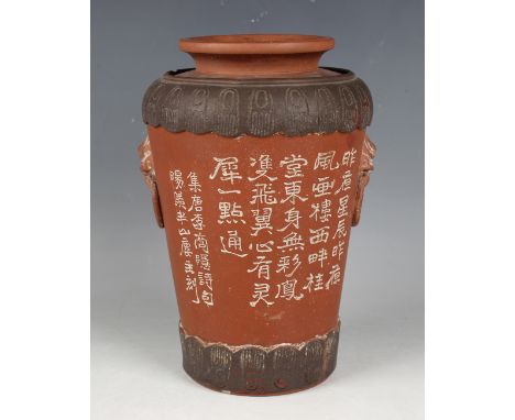 A Chinese Yixing stoneware vase, probably late Qing dynasty, of shouldered tapering form, enamelled with white characters and