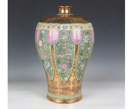 A Chinese famille rose porcelain baluster vase, mark of Qianlong but modern, the body decorated with eight faux shagreen grou