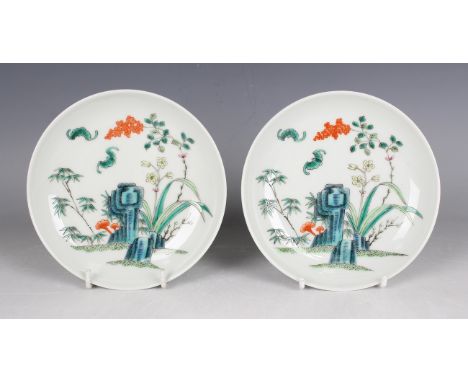 A pair of Chinese famille verte porcelain saucer dishes, mark of Tongzhi but 20th century or later, each painted with a pair 