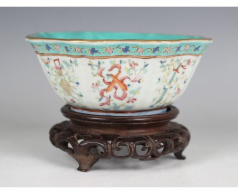 A Chinese famille rose porcelain bowl, mark of Tongzhi and probably of the period, of fluted octagonal form, the exterior ena