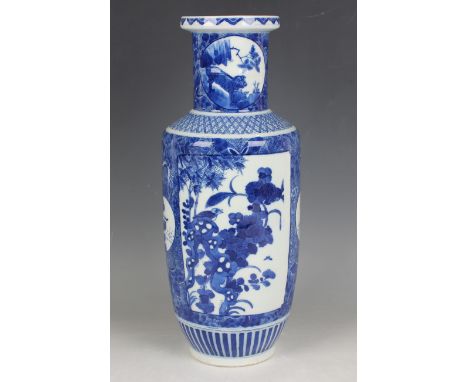 A Chinese blue and white porcelain rouleau vase, Kangxi style but late Qing dynasty, the body painted with opposing panels fi