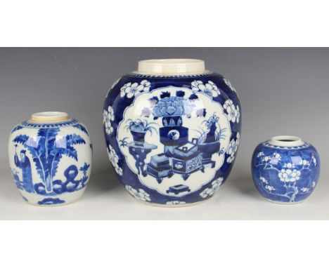 A Chinese blue and white porcelain ginger jar, mark of Kangxi but late 19th century, painted with figures in a fenced garden,