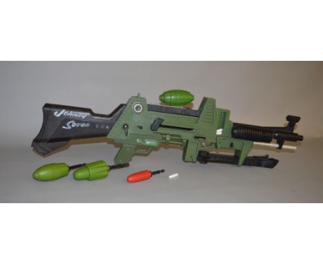 An unboxed 'Johnny Seven' plastic One Man Army Gun by Topper Toys, retaining stand and some grenades and bullets, unchecked f