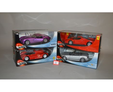 Four Mattel Hot Wheels 1:18 scale diecast models, including Ferrari and Cadillac. E in G boxes. (4)