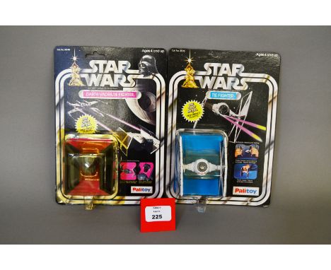 Two Palitoy Star Wars diecast models: Darth Vader's TIE, M, sealed on E card with yellowed bubble; TIE Fighter, E, on VG unpu