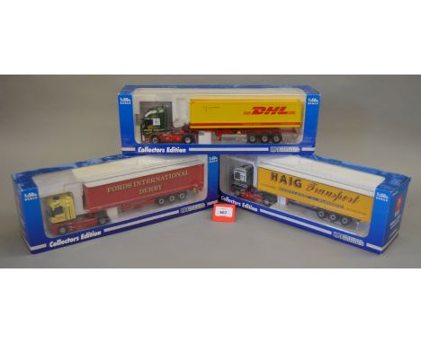 Three Universal Hobbies 1:50 scale diecast truck models, including: 5638 Renault; 5640A Iveco DHL; 5641 Renault Haig. VG in G
