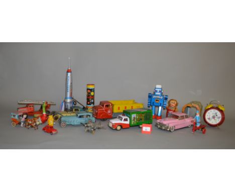 A Good selection of Tin-Plate and battery operated toys, including a Louis Marx Tipper Truck. Assorted Makes. Mostly playworn