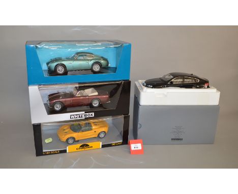 Four 1:18 scale diecast model cars including a Chrono Lotus Elise 1997; WhiteBox Aston Martin. VG, boxed. (4)