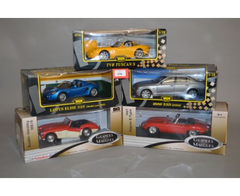 Five 1:18 scale diecast models: two ERTL Grandes Marques (Austin-Healey 100/6, 1967 Jaguar E-type); three JADI Modelcraft (TV