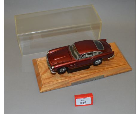 Two Danbury Mint Aston Martin DB5 diecast models, in 1:24 scale, including James Bond version  with silver coloured paint wor