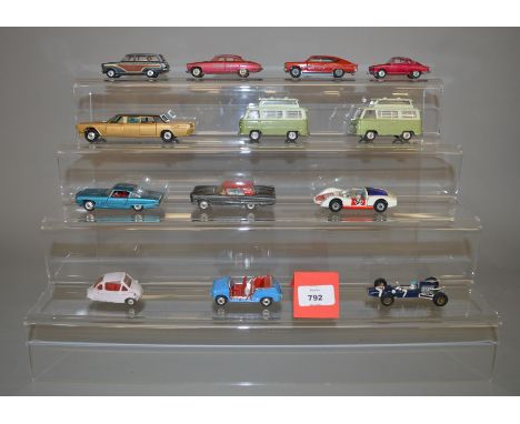 A small group of unboxed playworn Corgi diecast models including a 233 Heinkel in lilac with cast hubs and red interior, two 