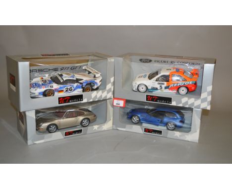 Four UT Models 1:18 scale diecast model cars: Porsche 993 Coupe; Porsche 911 GT Le Mans 1996; BMW Z3 M Coupe; Ford Escort RAC