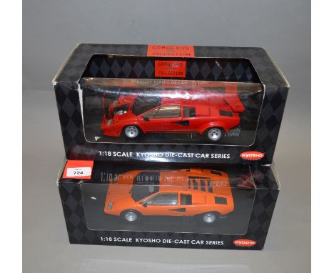 Two boxed Kyosho Lamborghini Countach diecast model cars in 1:18 scale, an LP500 in red  and an LP400 in orange. Models appea