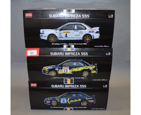 Three boxed Sun Star Subaru Impreza 555 diecast model cars in 1:18 scale, #2 C. McRae, #4 B. Beguin and #13 P. Bourne. Models