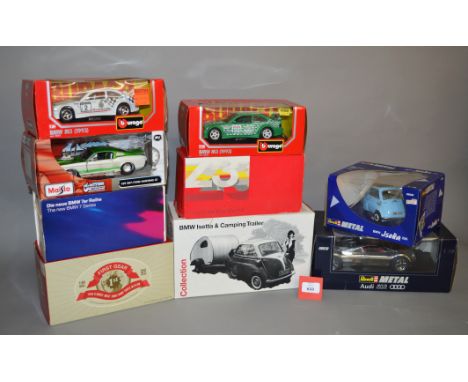 Nine assorted boxed diecast models in 1:18 and 1:24 scale, including examples by Maisto, Bburago, Revell, etc. Models appear 