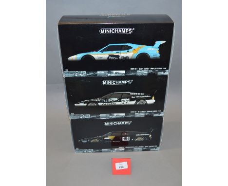 Three boxed Minichamps BMW M1 diecast models in 1:18 scale, Procar Series 1979, 1980 and ADAC 1000km 1986. Models appear VG i
