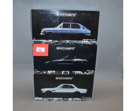 Three boxed Minichamps BMW  diecast model cars in 1:18 scale, a 2000 tii touring (1971), a 3.0 CSL (1972)  and  a Z1 (1988). 