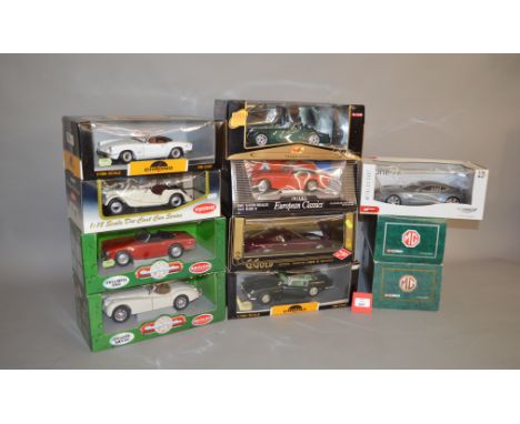 11 x 1:18 scale diecast models by Kyosho, Corgi, Britains and others, including: Triumph Spitfire; Morgan 4/4 Series II; Asto