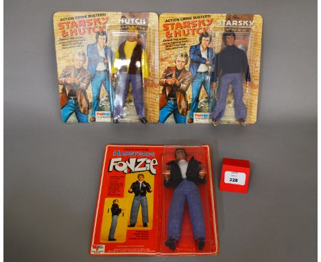 Three Mego action figures: Wiggins Teape Happy Days Fonzie, E, resealed on VG card; Palitoy Starsky & Hutch Starsky, M on VG 
