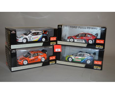 Four Sun Star 1:18 scale Ford Focus WRC diecast model cars: 3901; 3922; 3917; 3919. E in G-VG boxes. (4)