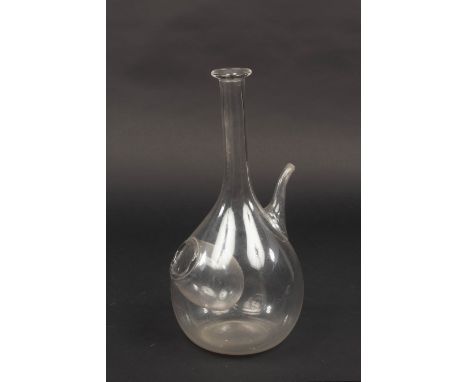 An English glass ice pocket decanter, the globular body with a side pocket, below a tall neck and with pouring spout, 39cm hi