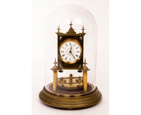 A brass torsion clock, the 2" white enamel dial marked D.R. Patent 2437 / R.L Patent 2182 / U.S Patent 269052, over a disc pe