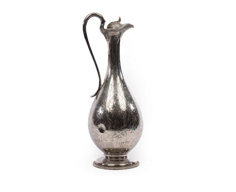 A Victorian silver claret jug, George John Richards & Edward Charles Brown, London 1863, with hinged cover and scroll handle,
