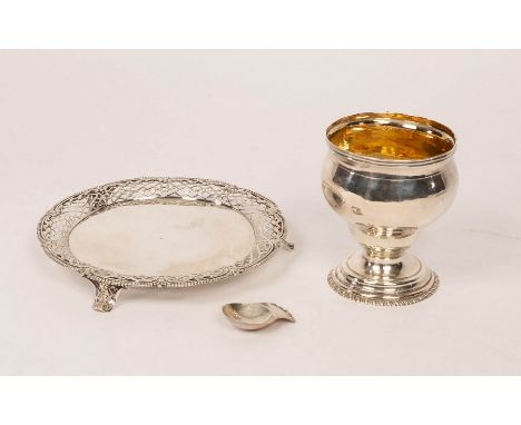 A George II silver waiter, JS, London 1759, with beaded rim, pierced border and feet, 19cm diameter, an unmarked white metal 