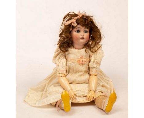 A porcelain headed doll by Simon &amp; Halbig, the head marked K &amp; R and numbered 46x, with sleepy eyes and open mouth, j