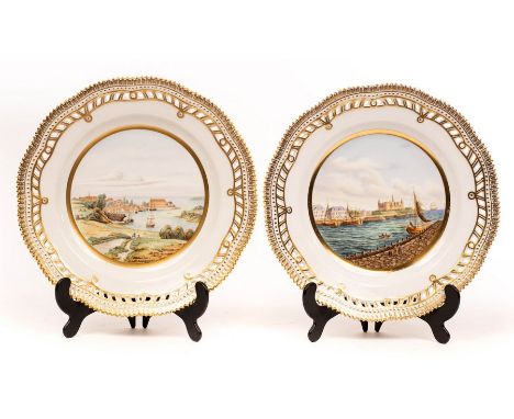 A pair of Royal Copenhagen cabinet plates, shape 3553, depicting harbour scenes with pierced gilded borders, 25.5cm diameter 