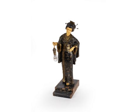A table lamp, the bulb supported by a figure of a Japanese girl wearing a decorative robe, her head, hands and feet in ivorin