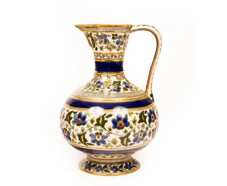 A Zsolnay Pecs ewer decorated scrolling foliage and gilt, 28.5cm high CONDITION REPORT: Flat chip/wear to top of spout.  Othe