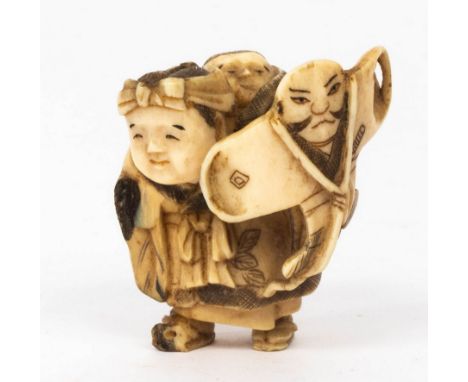 A Japanese ivory netsuke, Meiji period, depicting a grandmother with child on her back holding a kite, 5cm high CONDITION REP