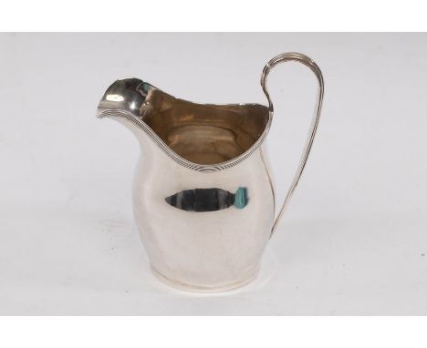 An Edwardian silver cream jug, Nathan & Hayes, Chester 1908, with reeded lip and loop handle, approximately 141gm CONDITION R