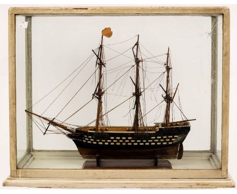 A scale model of a three-masted ship, 46cm long, in a glazed case (cracks to glass)