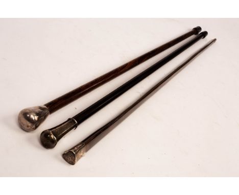 An ebonised walking stick with German 925 silver knop, 88cm long, and two rosewood walking sticks with silver knops (3)