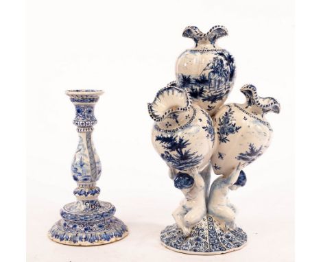 A Continental faience pot pourri vase on cherub support, marked beneath B V 5, 39cm high and a Dutch Delft candlestick CONDIT