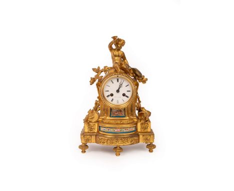 A French gilt metal mounted mantel clock, the white enamel dial signed Pepin a Paris, surmounted by a Bacchante and set with 