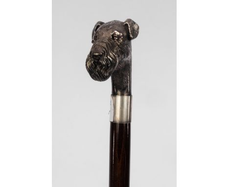 A silver mounted walking stick, the handle modelled as the head of an Airedale terrier, marked 925, 90cm long