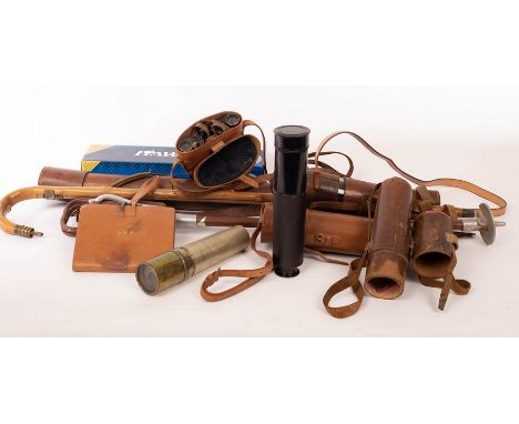 Two telescopes in leather cases, a pair of field glasses, various leather cases and a shooting stick 