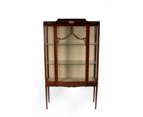 An Edwardian mahogany cushion top display cabinet, the frieze painted a central oval of garlands of flowers and ribbon ties, 