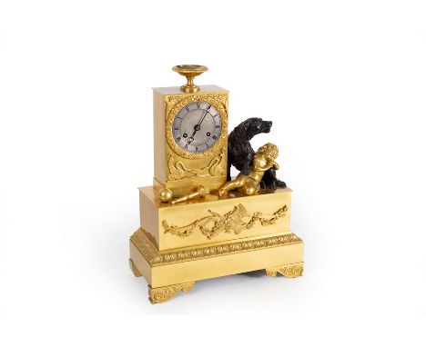 A French gilt metal eight-day mantel clock, the case with urn surmount, a figure of a dog beside a sleeping child, the steel 