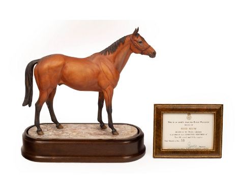 A Royal Worcester figure of Red Rum, modelled by Doris Lindner, number 58/250, on a wooden plinth, 28cm high including plinth