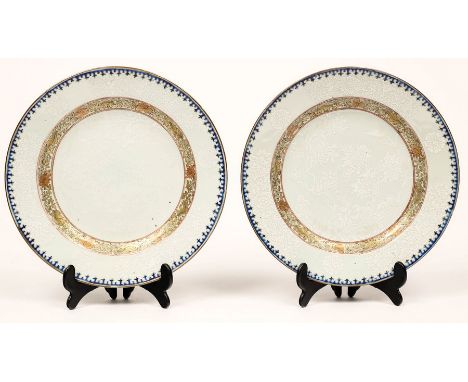 A pair of Chinese pâte-sur-pâte plates, circa 1740, 22.5cm diameter CONDITION REPORT: One has two tiny rim chips, otherwise c