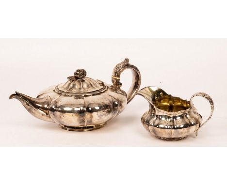 A George IV silver teapot and cream jug, Charles Thomas Fox, London 1828, of melon shape, the teapot with rose finial and bon