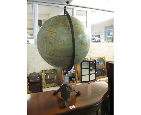 Phillips New Physical Terrestrial Globe on cast metal triform base.