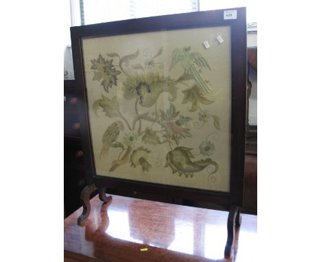 Stained mahogany tapestry fire screen depicting birds amongst foliage.